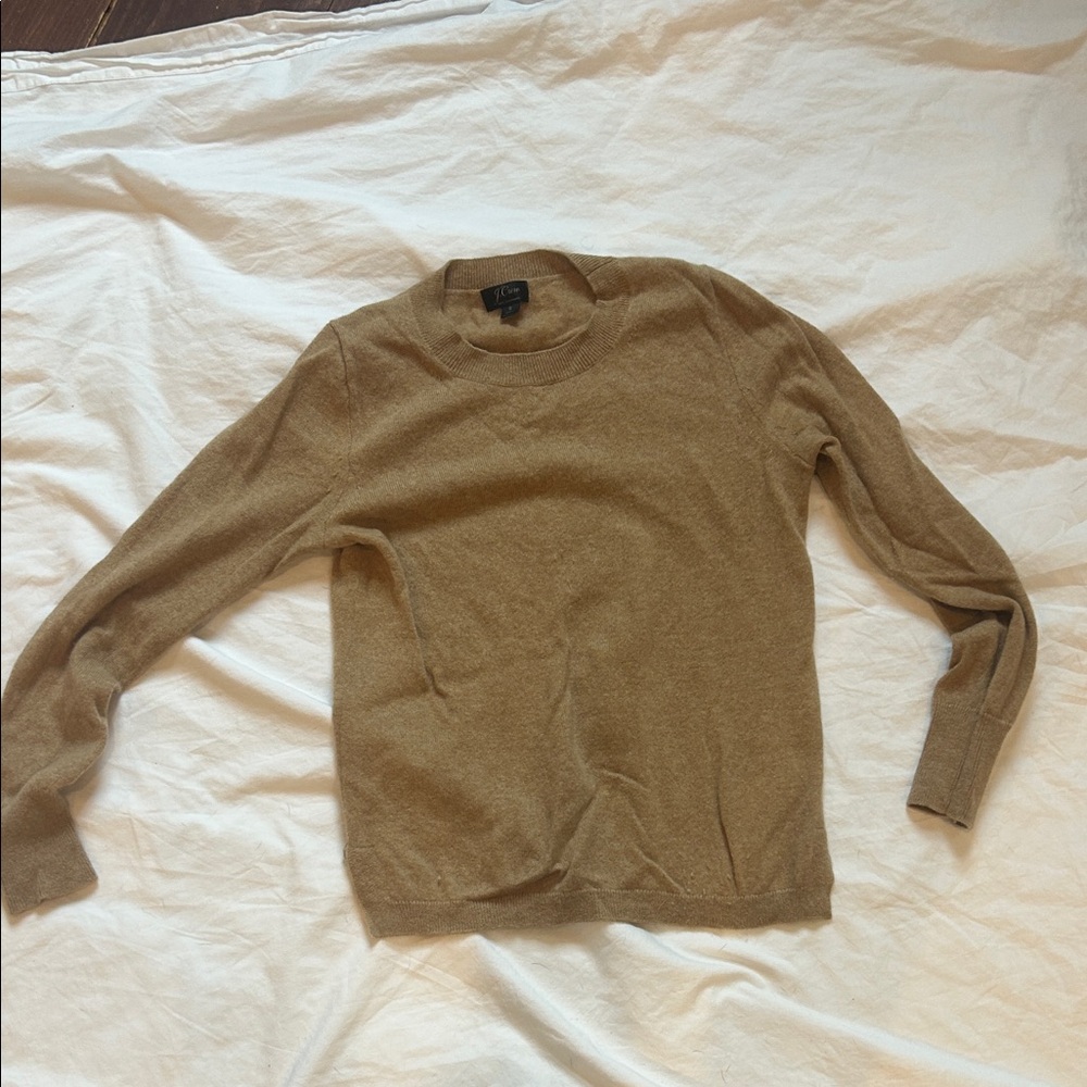 Woman’s tan cashmere sweater